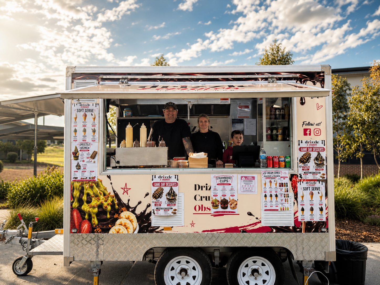 The Drizzle & Crunch van open for service at dusk, with the family serving from the window